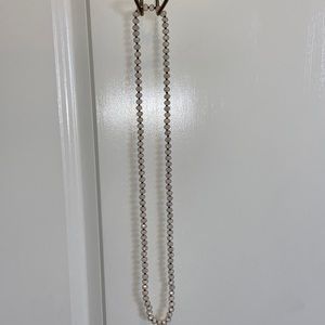 Cream colored beaded long necklace. Never worn.